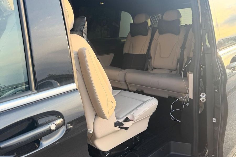 Cream leather seats inside the premium van